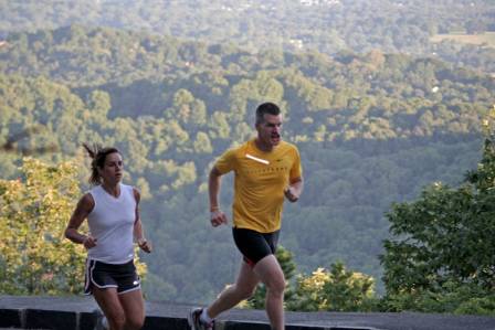 runners-over-mountain-setting